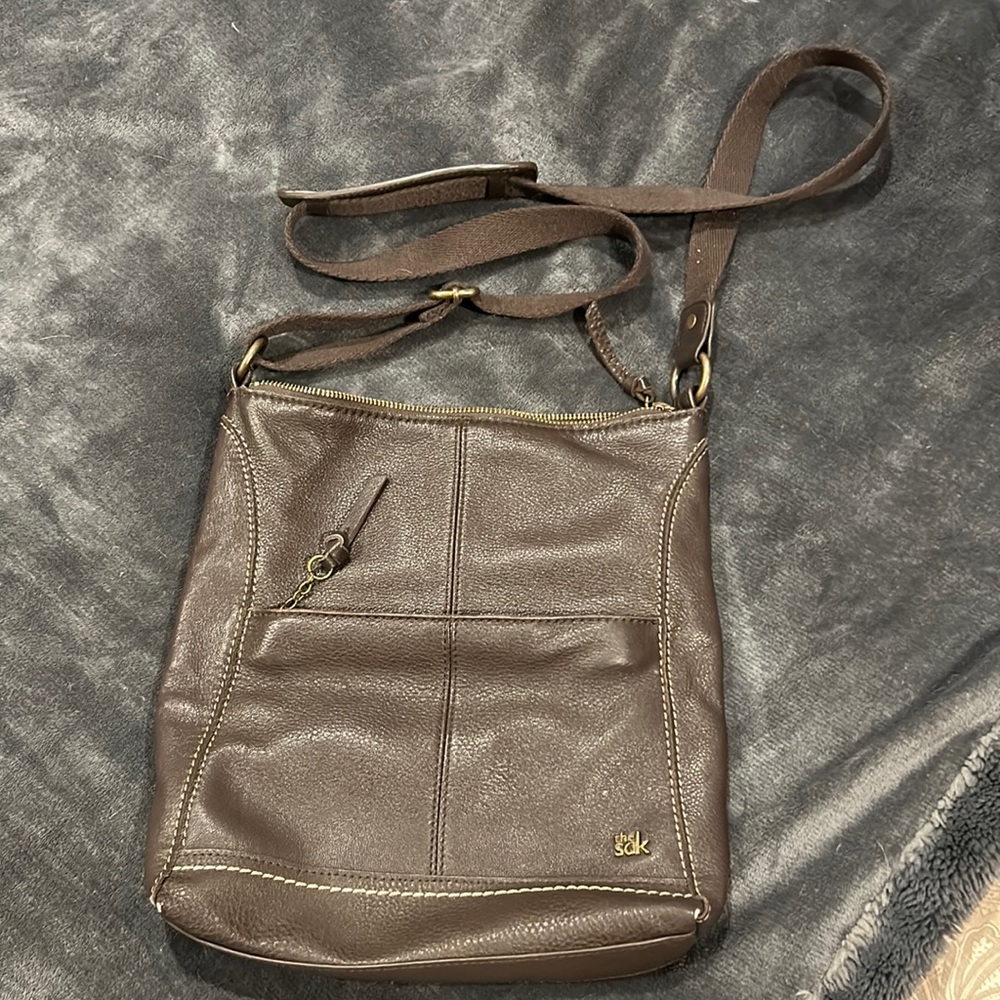 cross body bag 11in x 11.5 in, 2 outside pockets, 1 large zipper pocket inside